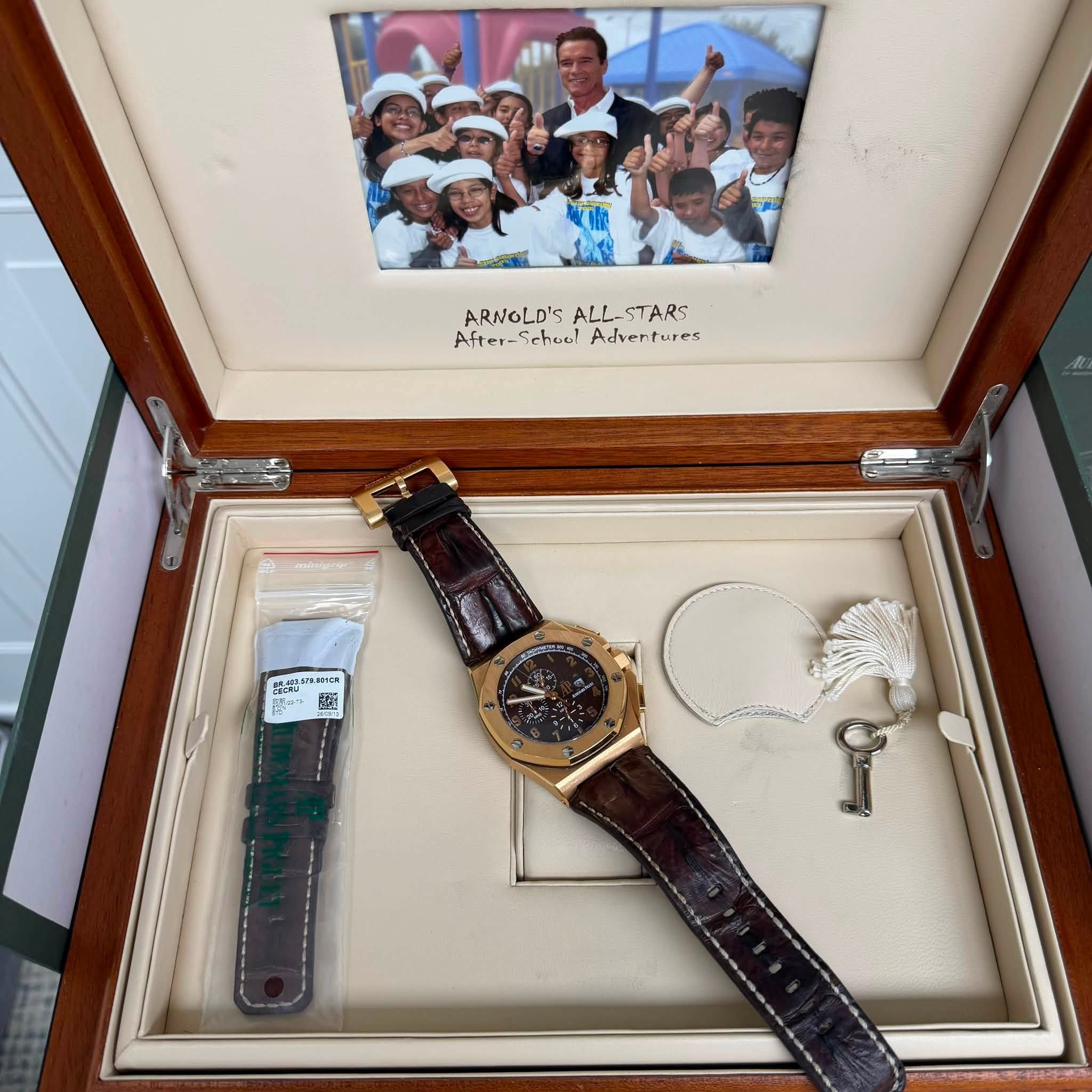 May be an image of wrist watch and text that says 'ARNOLD'S ARNGLD'SALL-STARS ALL- STARS After-SchuulAdvertures After-Sehool After- Sehool Adventures ...HC BHcK GNE 超'