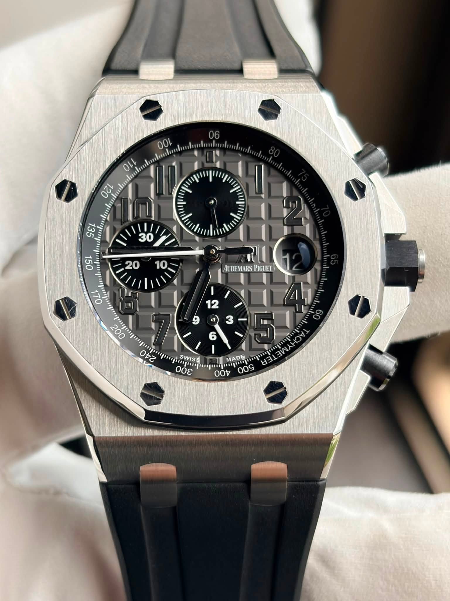 May be an image of wrist watch and text