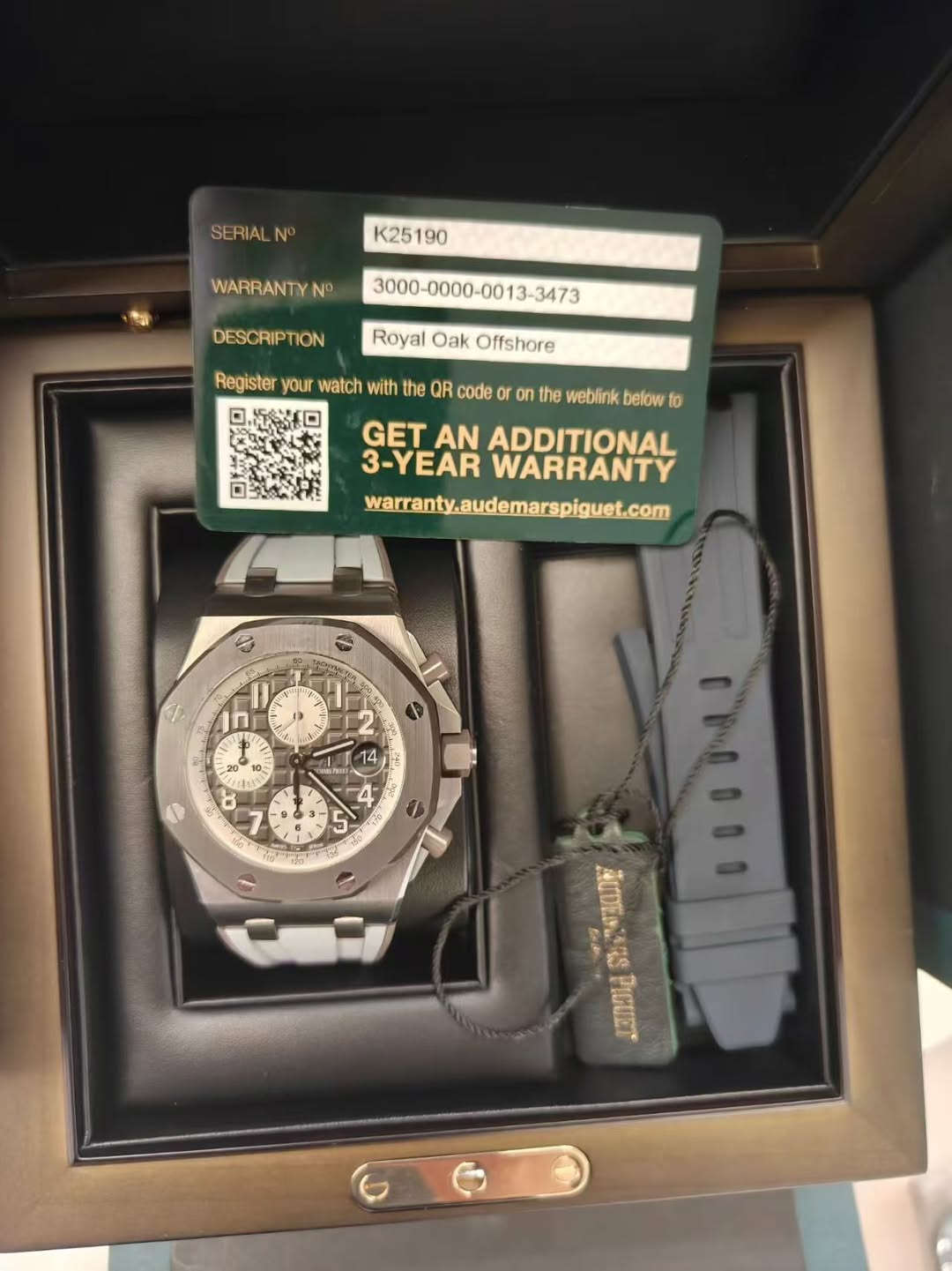 May be an image of wrist watch and text that says 'SERIALN N K25 190 WARRANTYN No DESCRIPTION Royal Oak Offshore Register your watch with the QR code O the weblink below to GET…