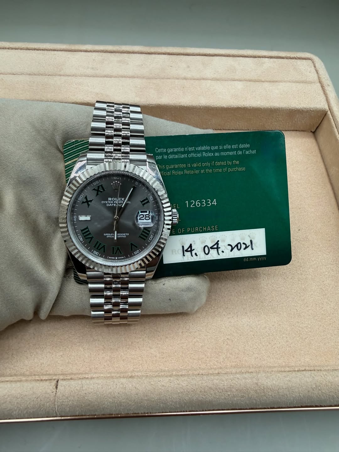 May be an image of wrist watch and text