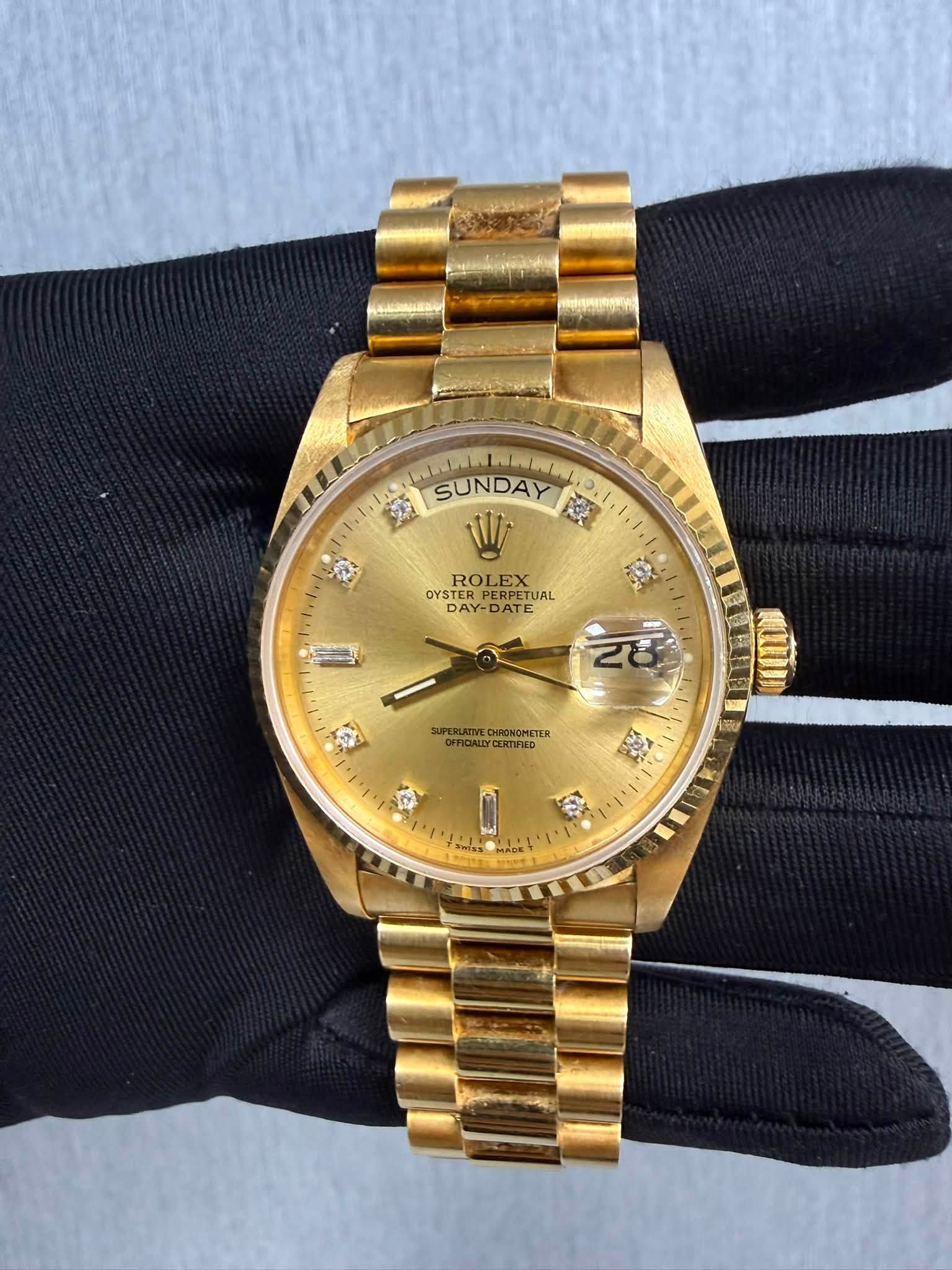 May be an image of wrist watch and text