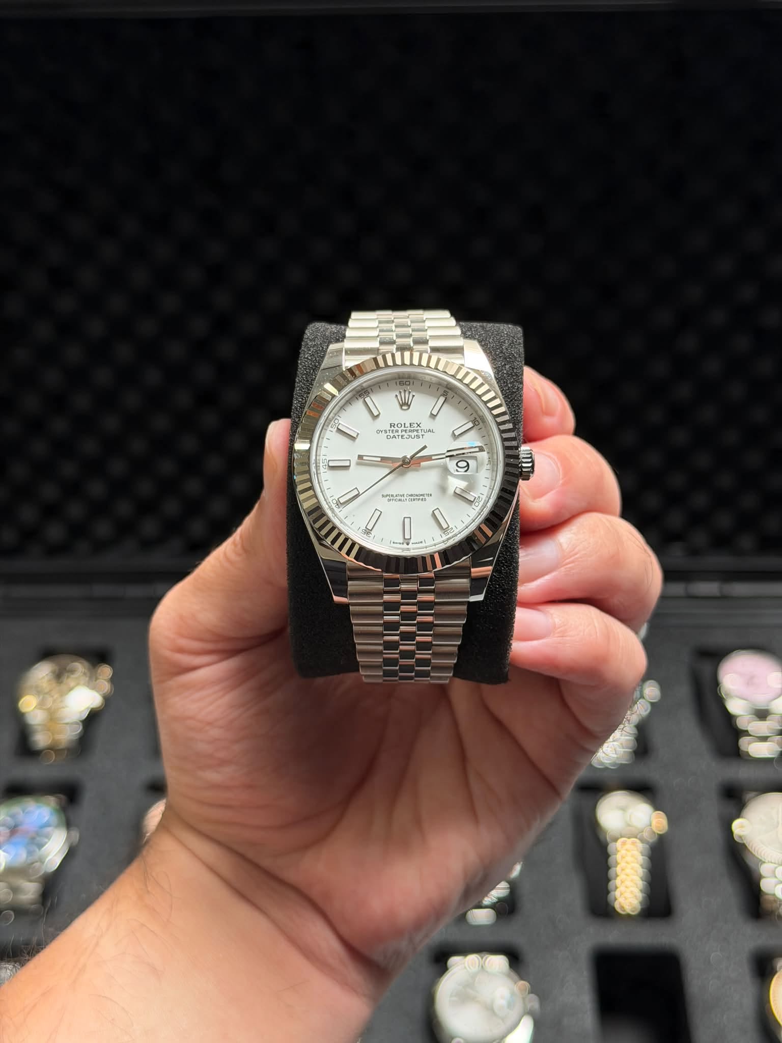 May be an image of wrist watch and text