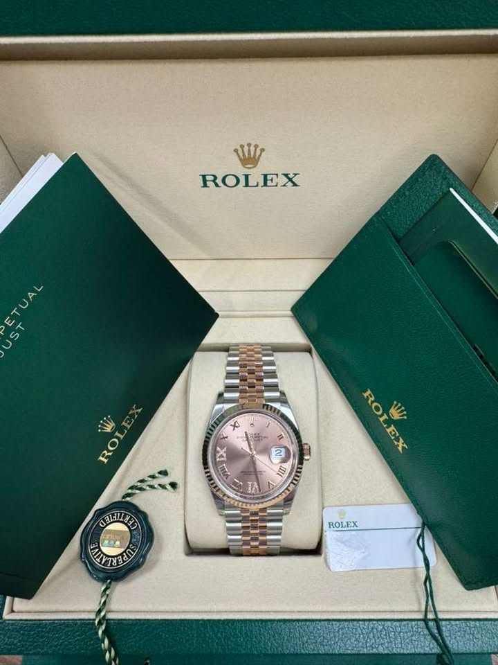 May be an image of wrist watch and text that says 'W ROLEX PETUAL ΕΥυΑb UST X تنق ROL 전을 IX ROL W ROLEX LEX ល ወ 원도 ٨ 1BL CELILED ROLEX'