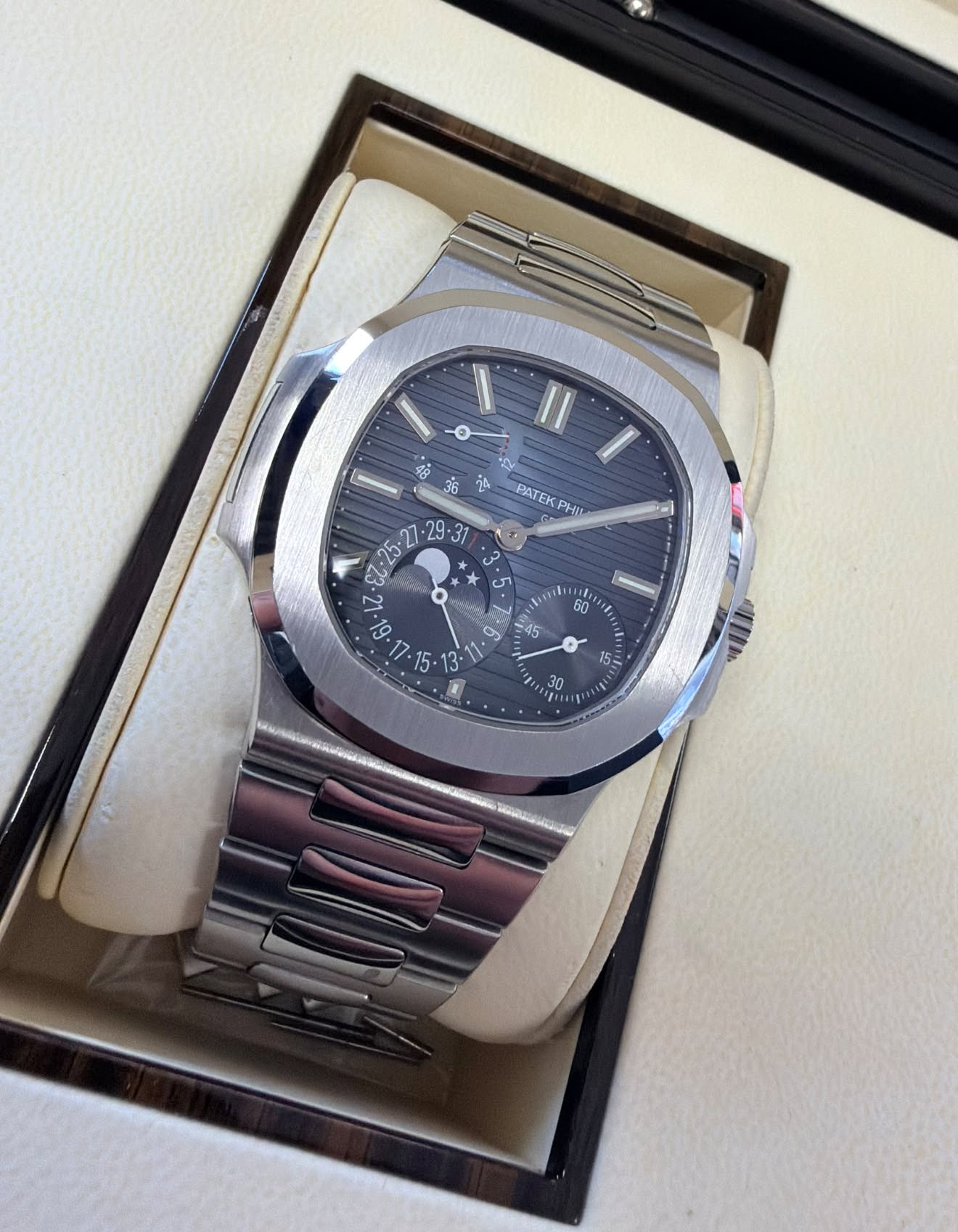 May be an image of wrist watch and text