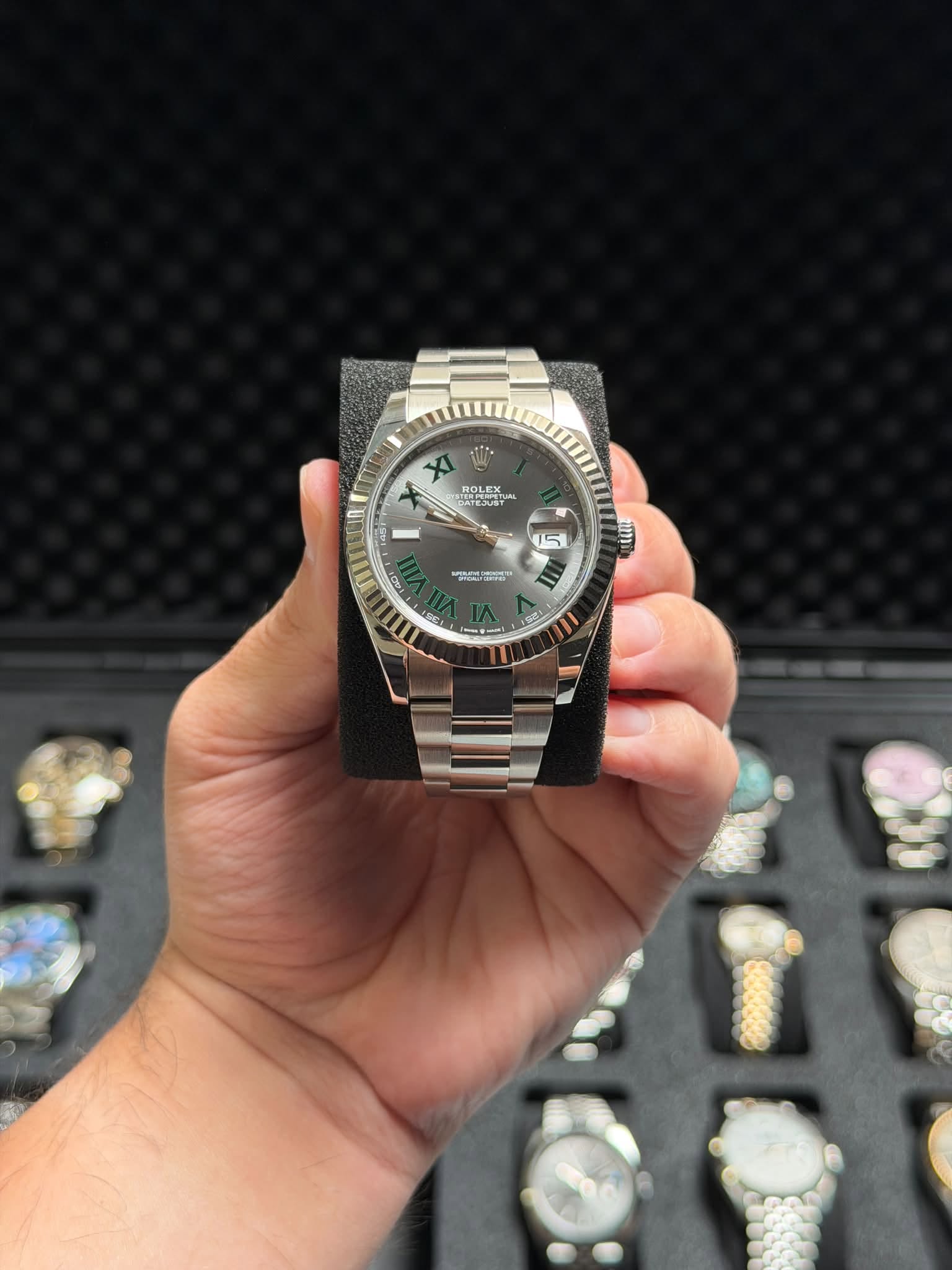 May be an image of wrist watch and text