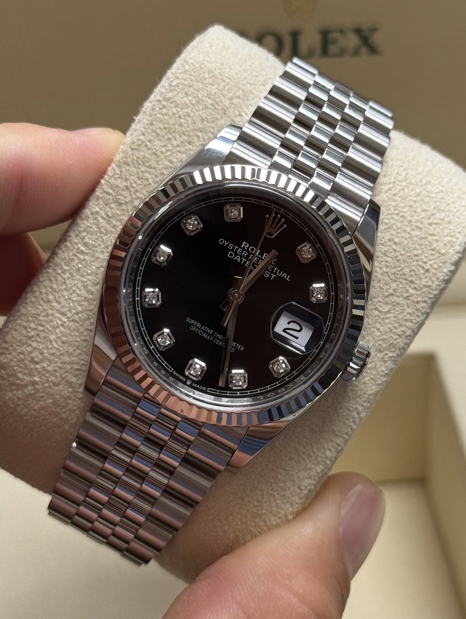 May be an image of wrist watch and text