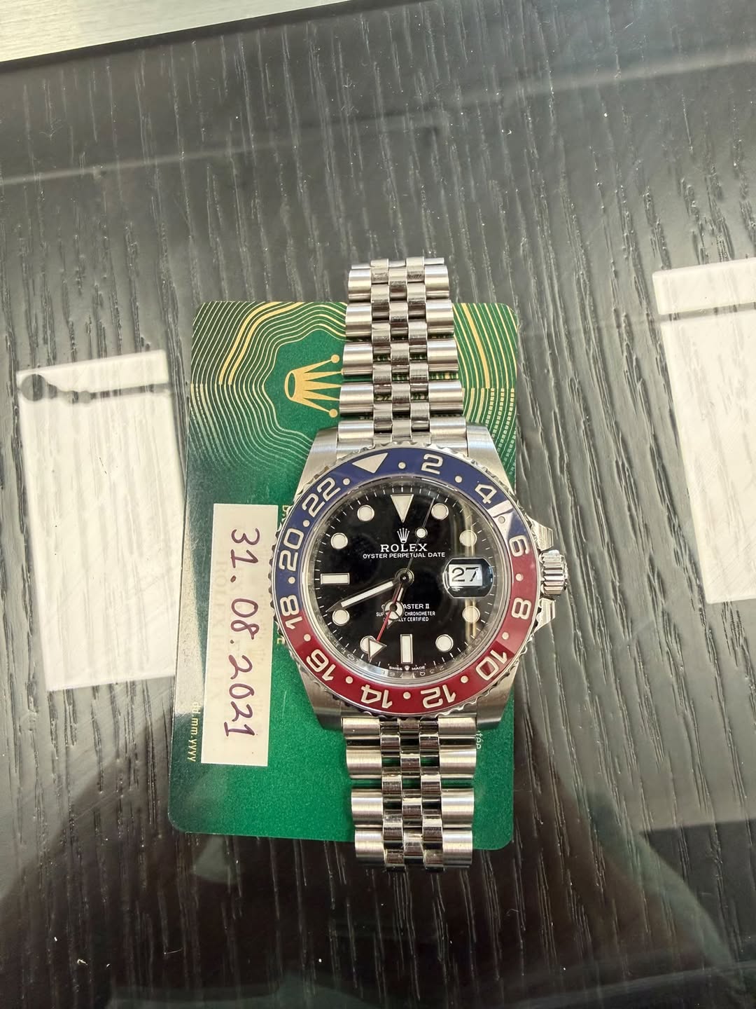 May be an image of wrist watch and text