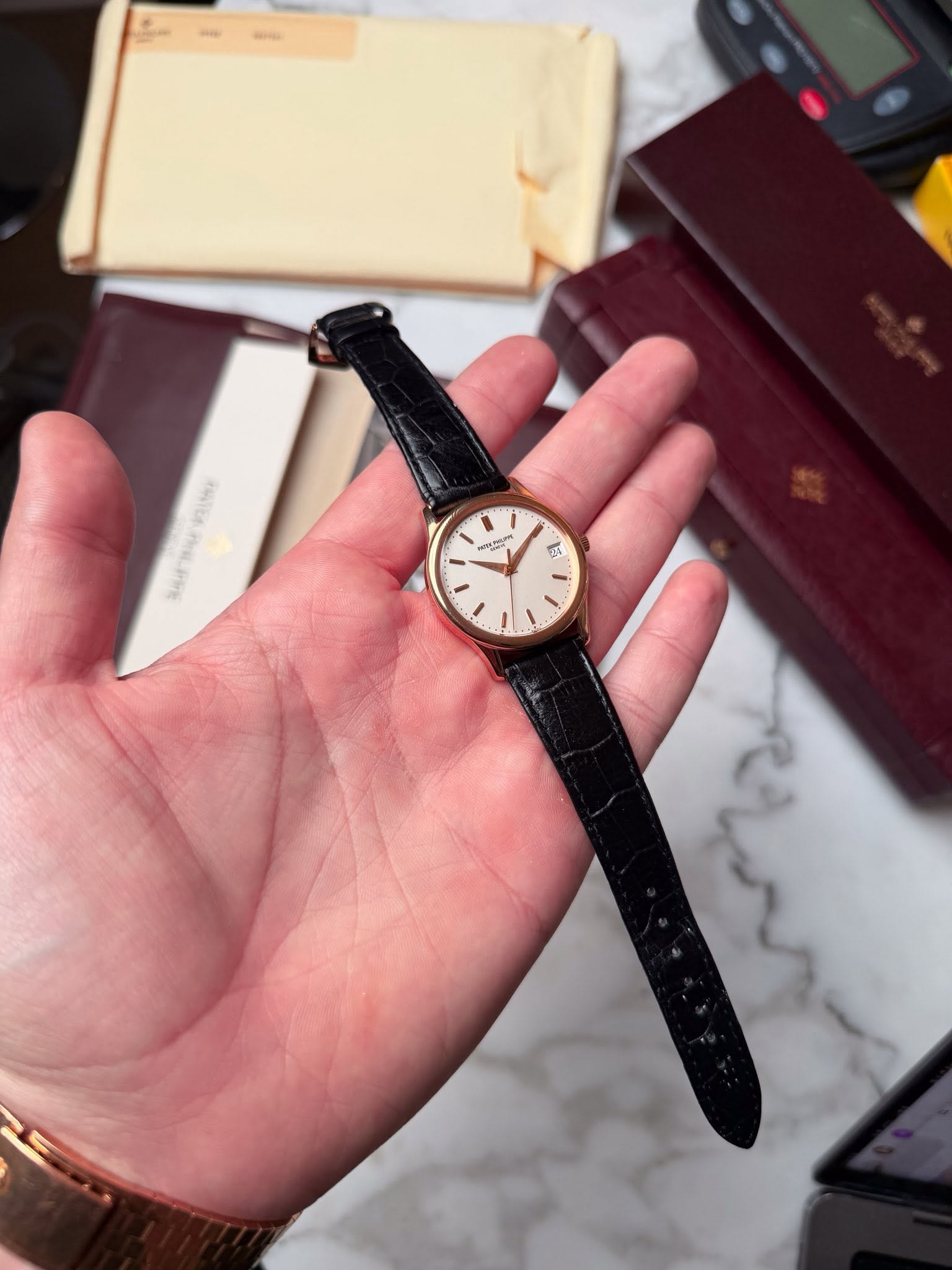 May be an image of wrist watch and text