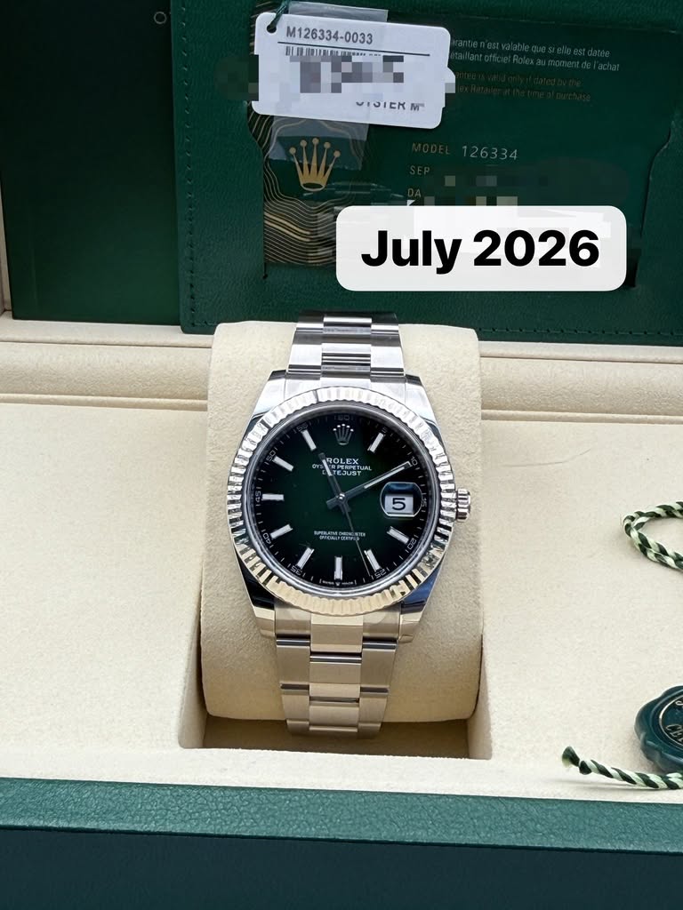 May be an image of wrist watch and text that says 'M126334-0033 រ 0033 民 日-- M July July2026 2026 ROLEX TEJUST 5 " ענר nИT'