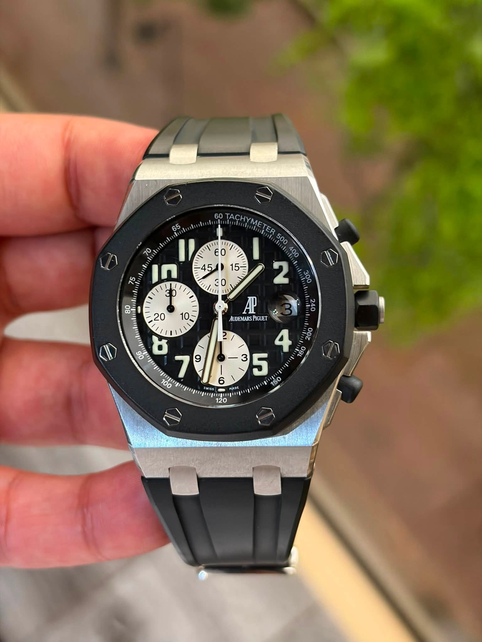May be an image of wrist watch and text