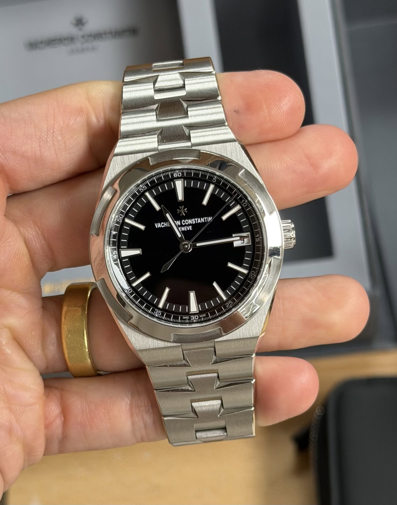 May be an image of wrist watch and text