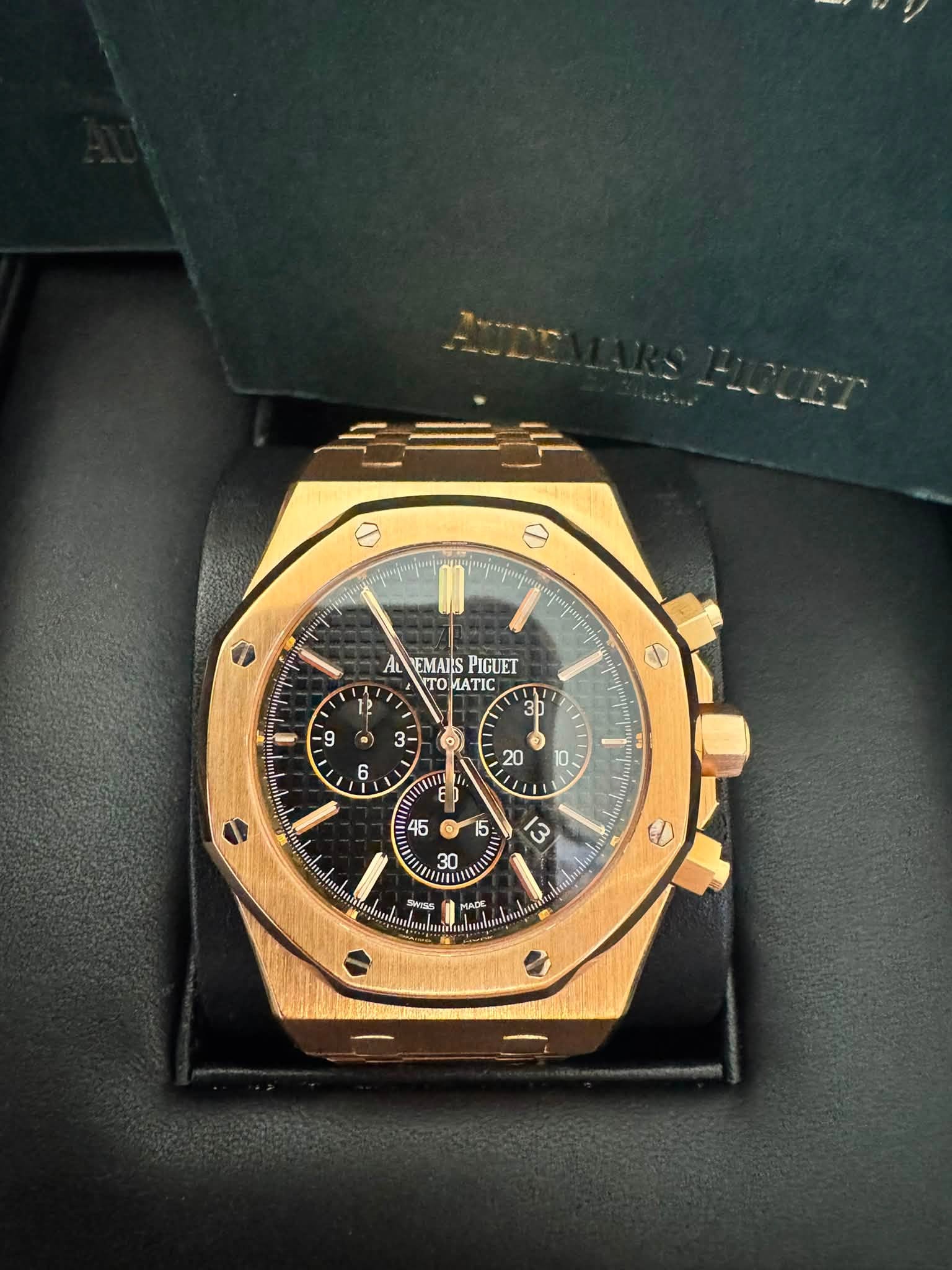 May be an image of wrist watch and text that says '0 AL EMAIS PIGUET TO TO ATIC rpи3pи 12 ግያ 1 9 S 31 D . E N H leash SwTss ل MADE ACE "ល urk'