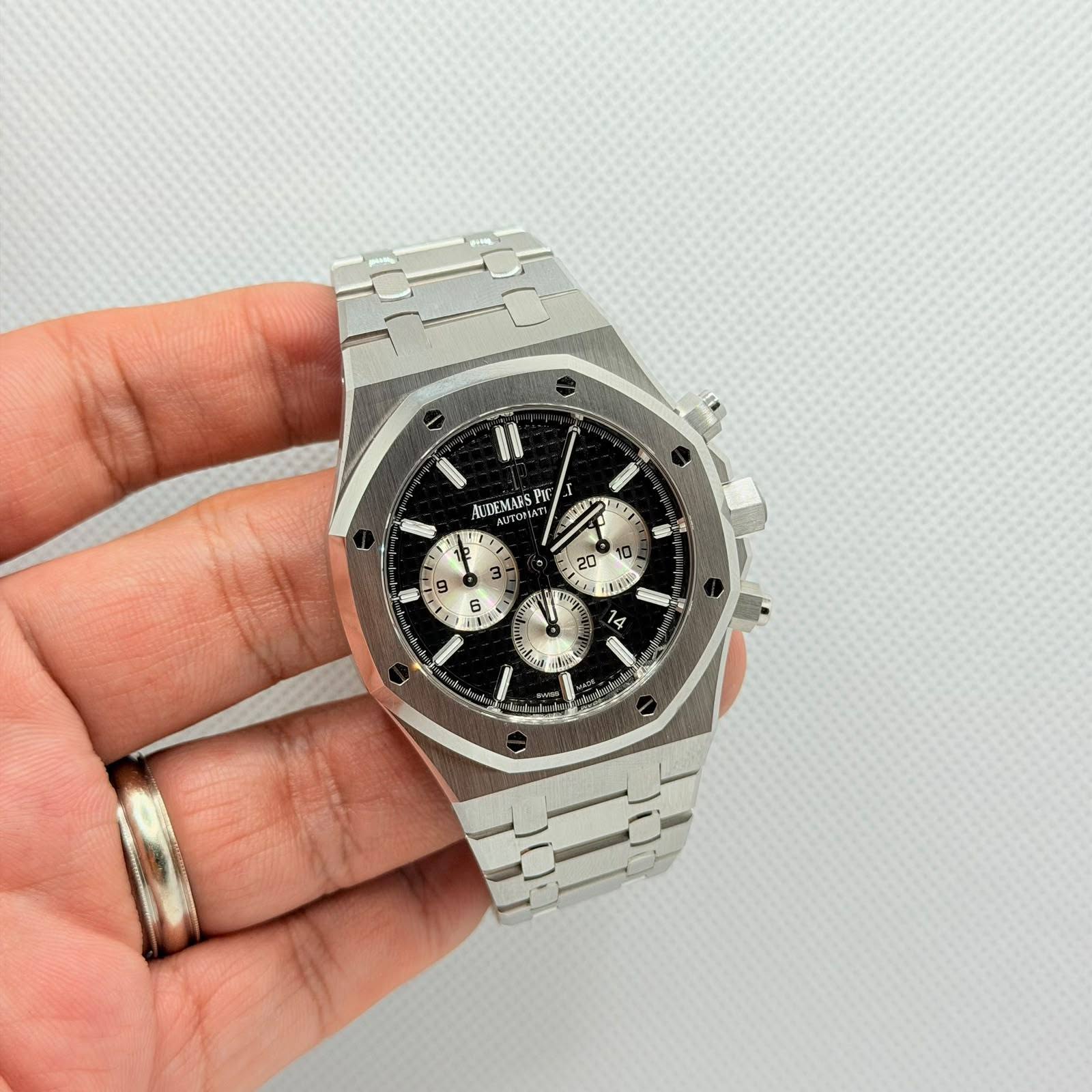 May be an image of wrist watch and text