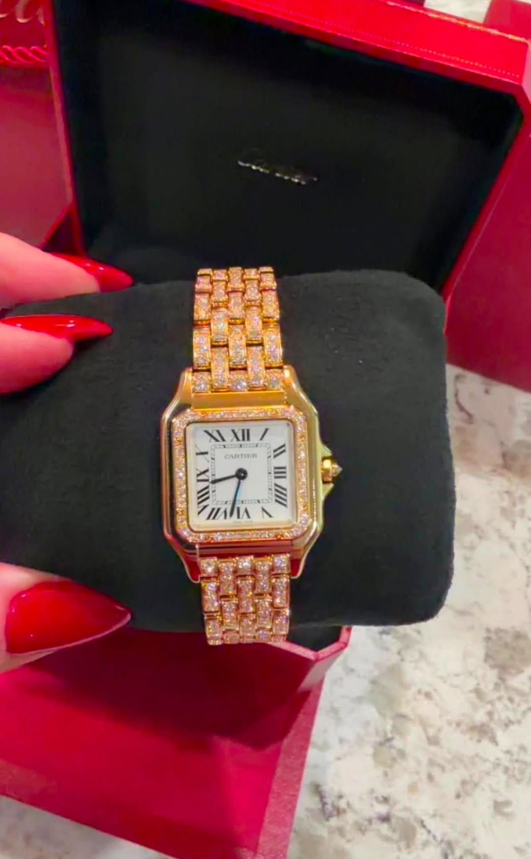 May be an image of wrist watch and text