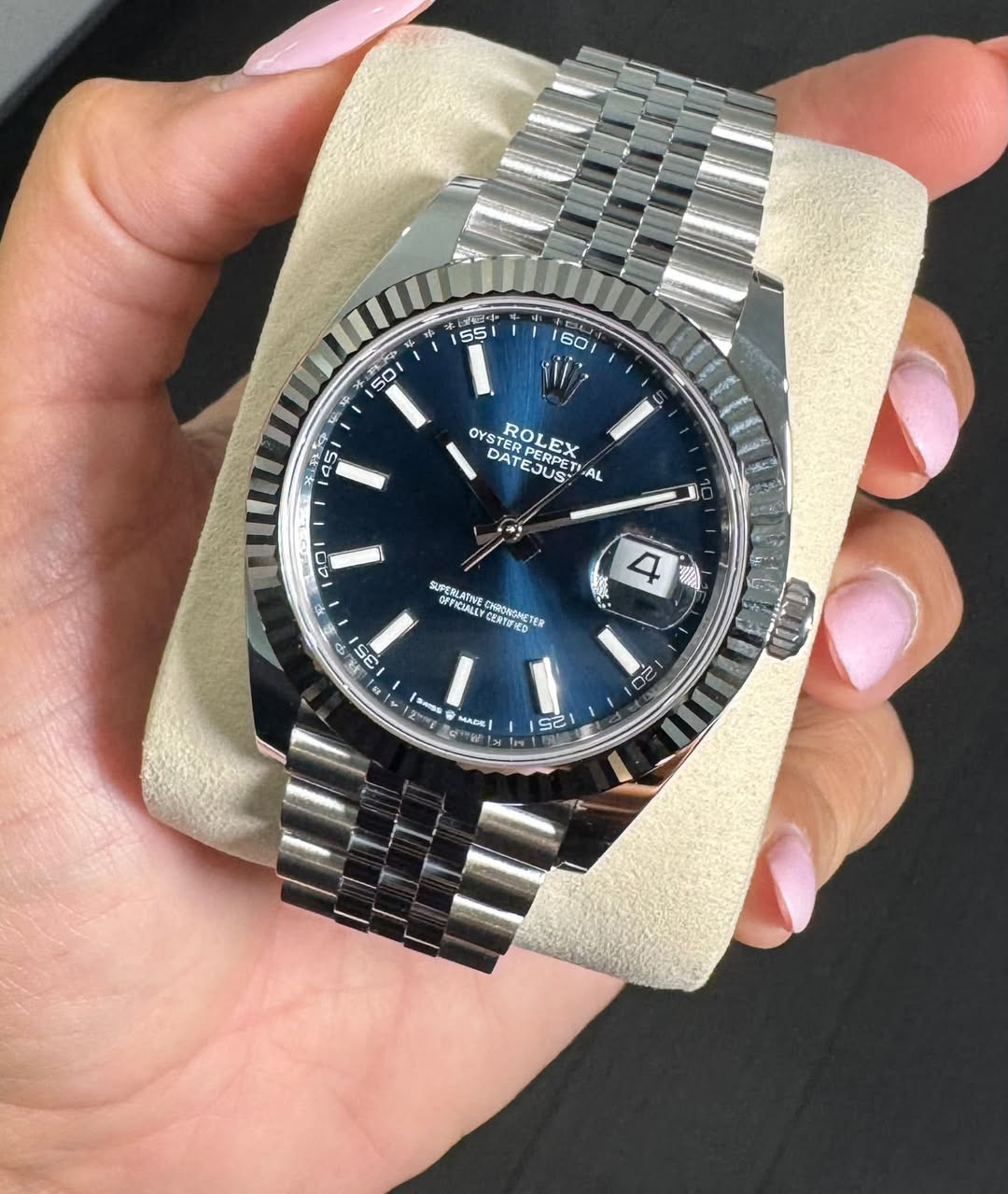 May be an image of wrist watch and text