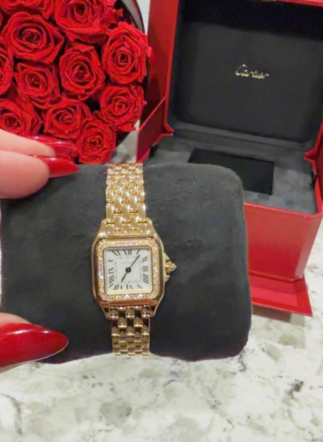 May be an image of wrist watch and text