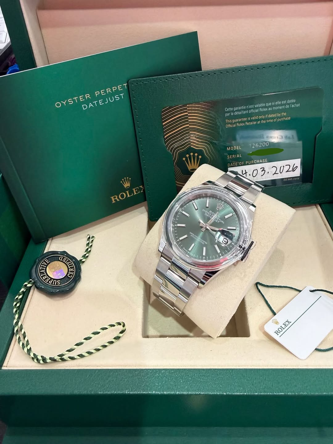 May be an image of wrist watch and text