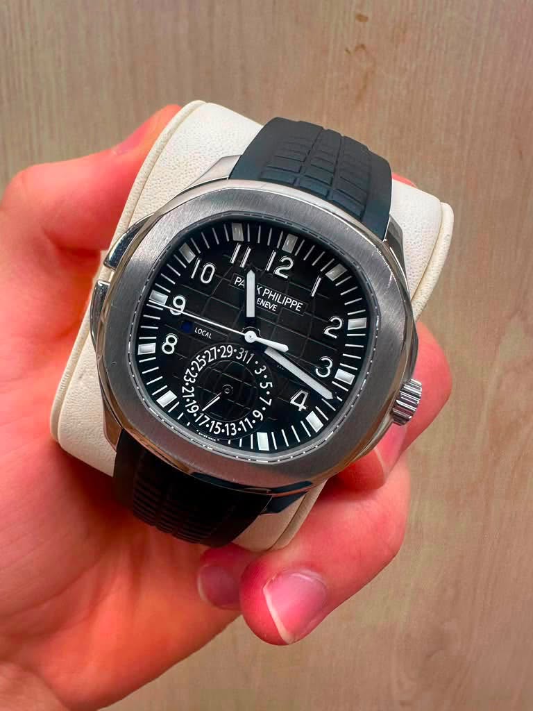 May be an image of wrist watch and text
