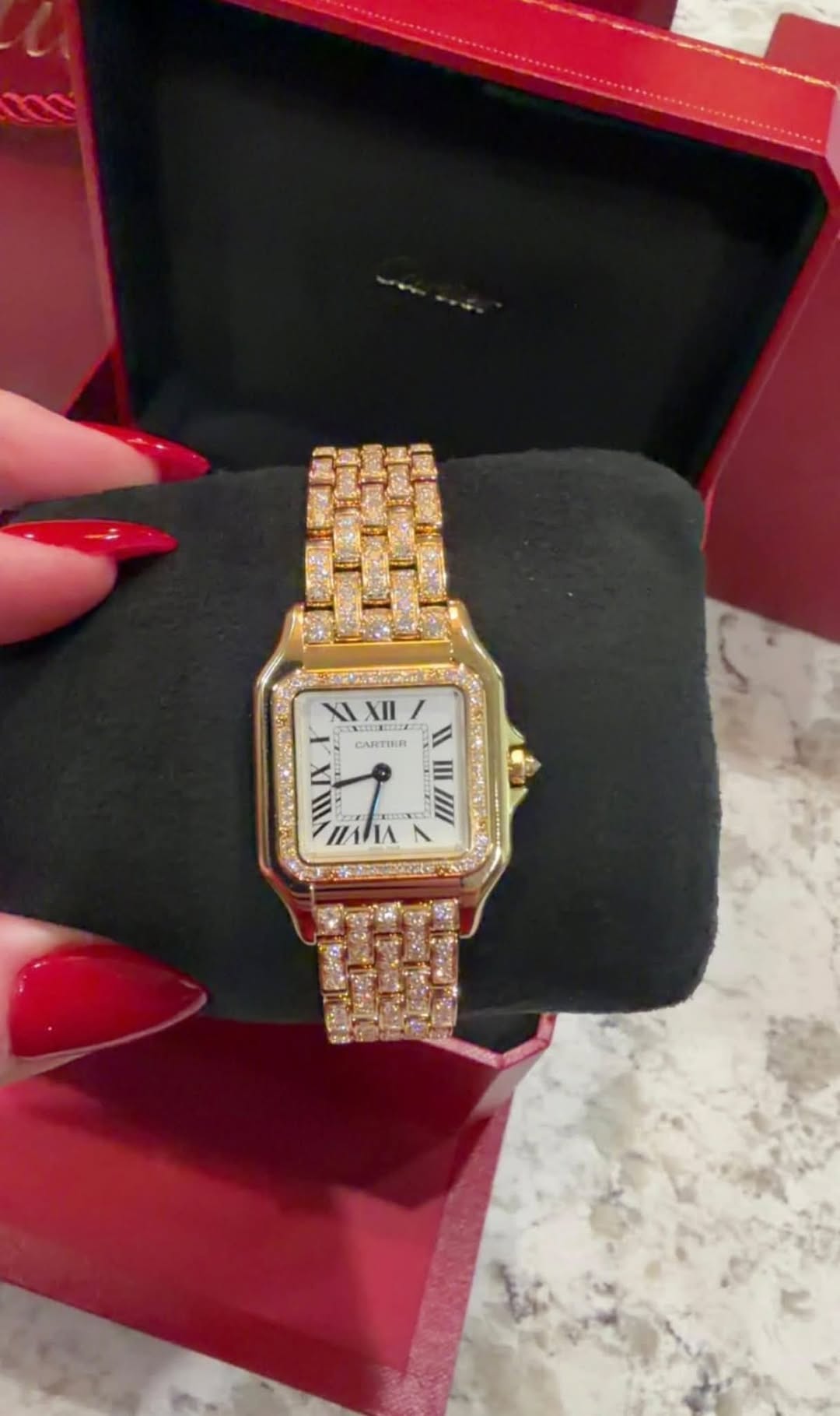 May be an image of wrist watch and text