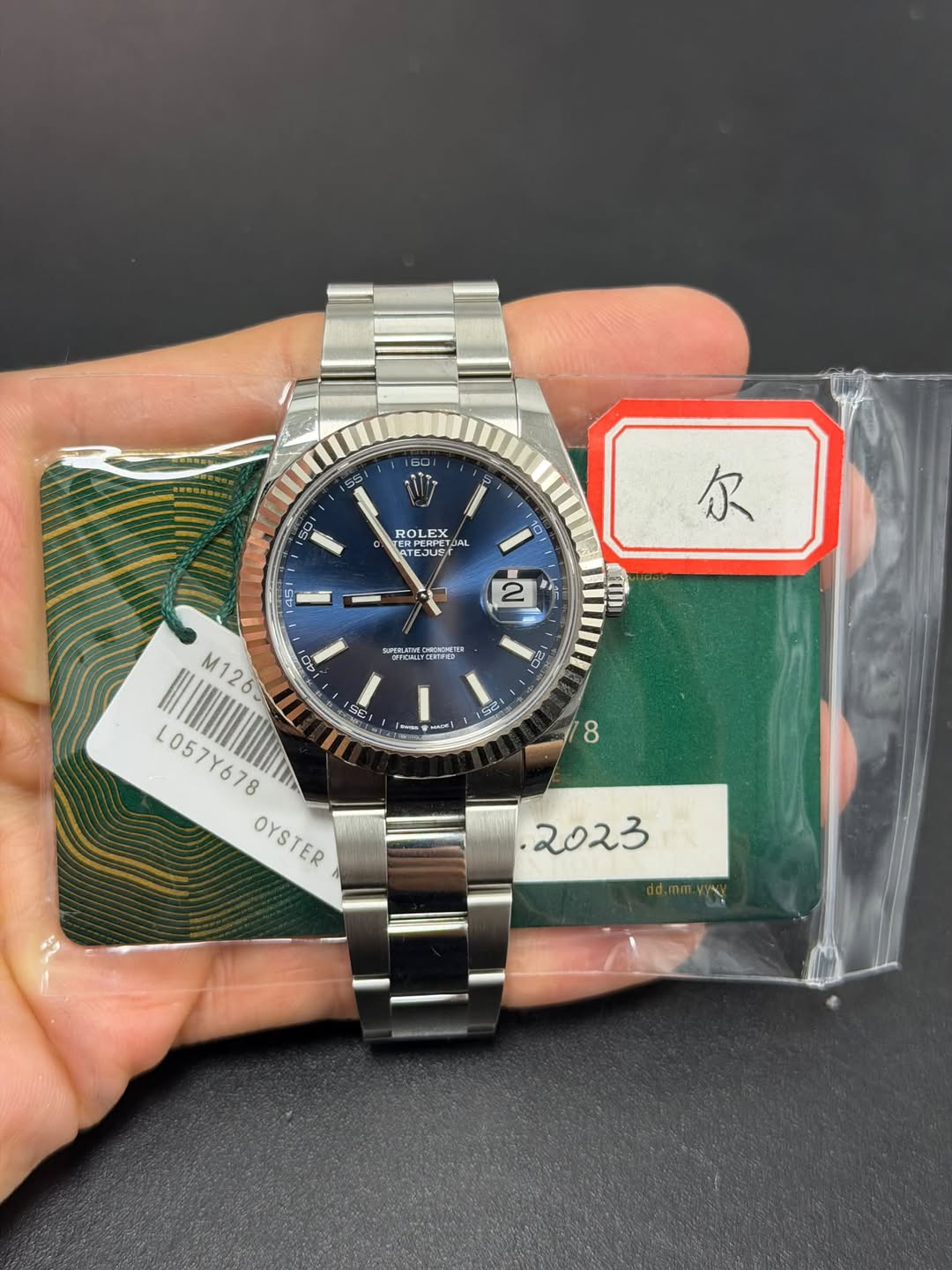 May be an image of wrist watch and text