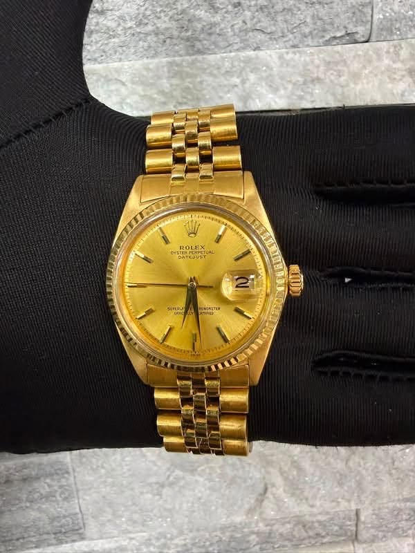 May be an image of wrist watch and text