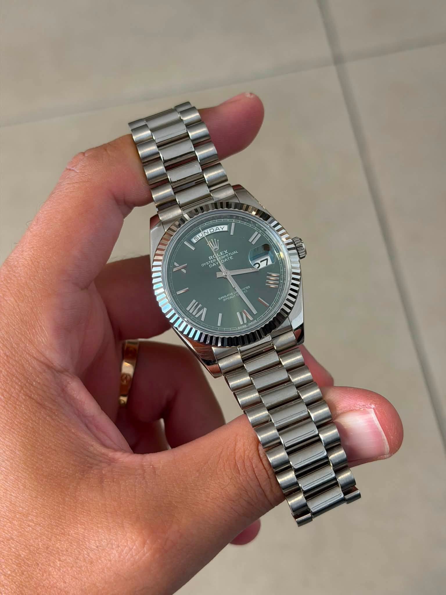 May be an image of wrist watch and text