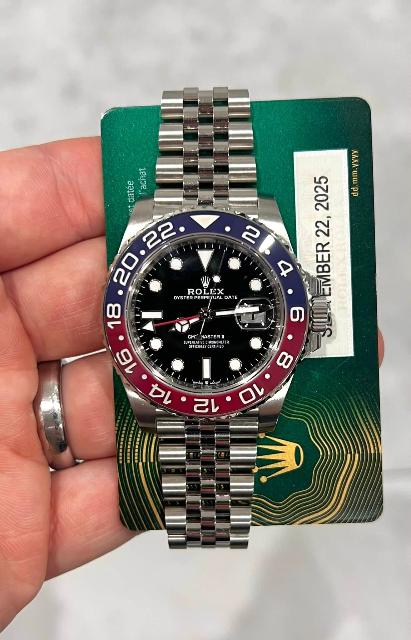 May be an image of wrist watch and text