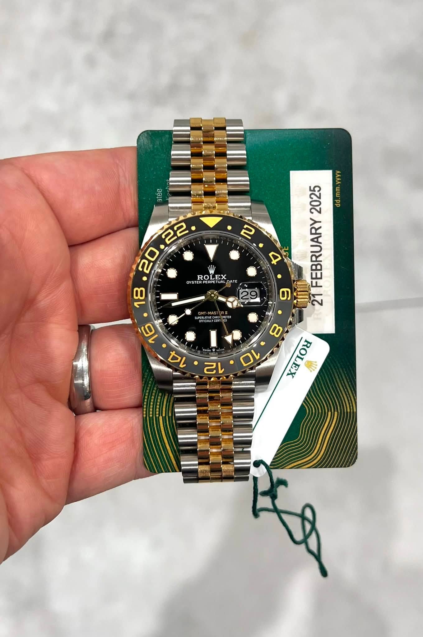 May be an image of wrist watch and text that says 'atee ቤ 2025 VVYV d.mm.vyyv D St FEBRUARY 6 21 ROLEX ROLEX RA'