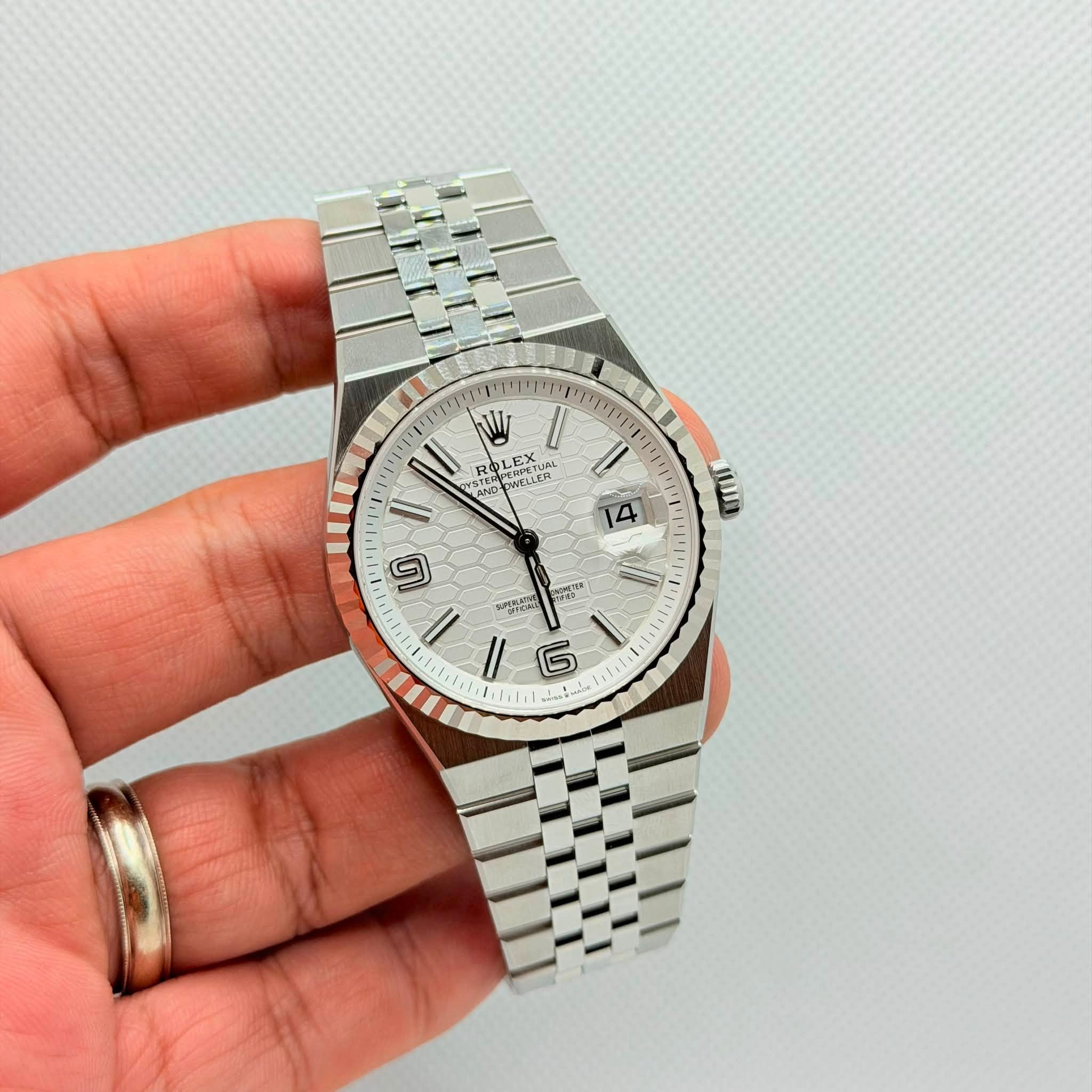 May be an image of wrist watch and text