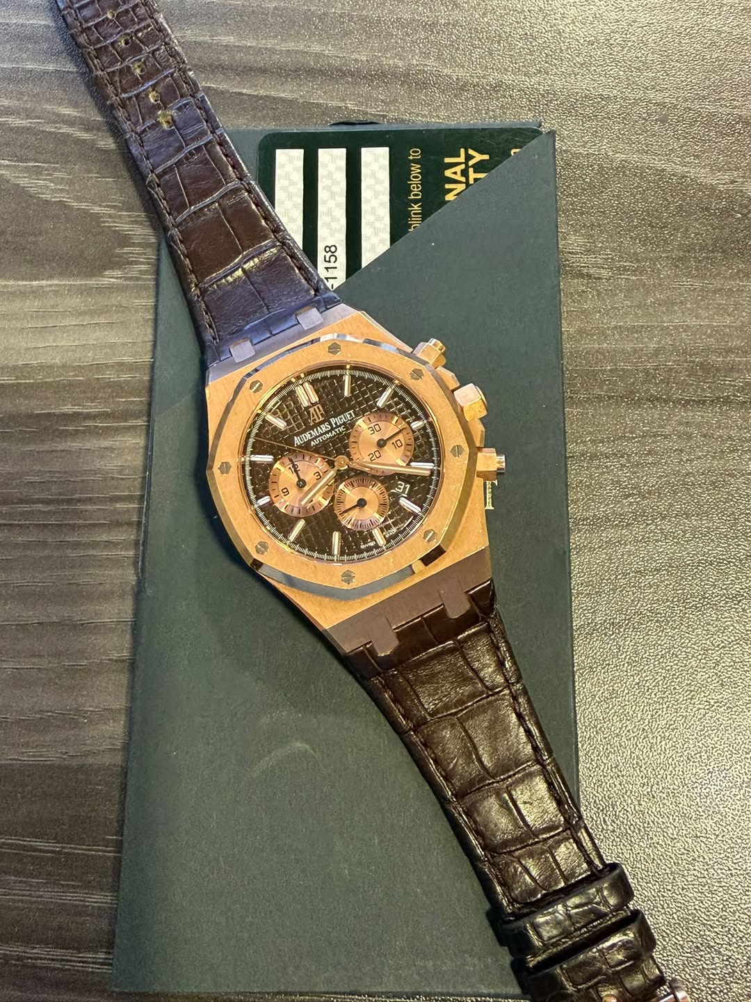May be an image of wrist watch and text