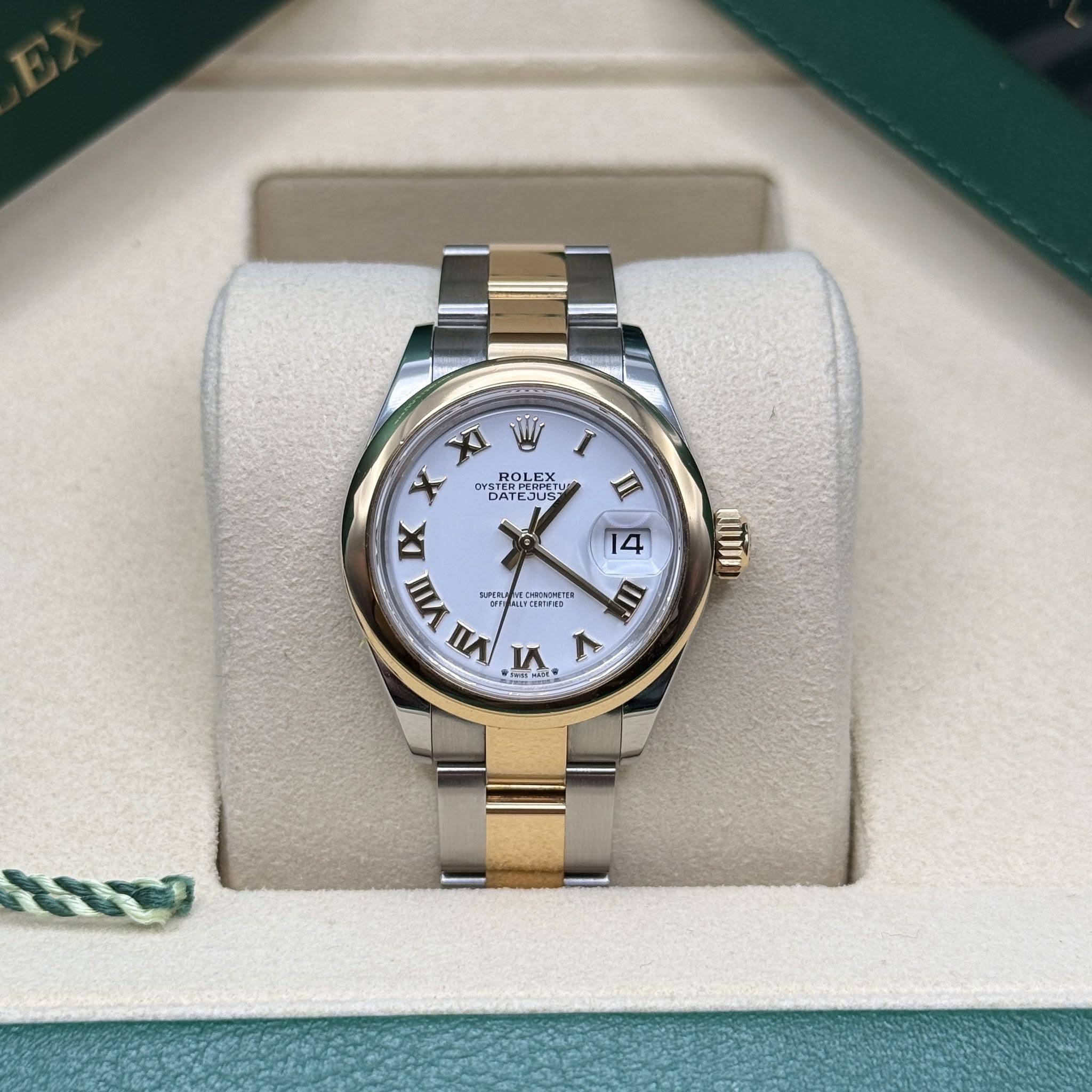 May be an image of wrist watch and text