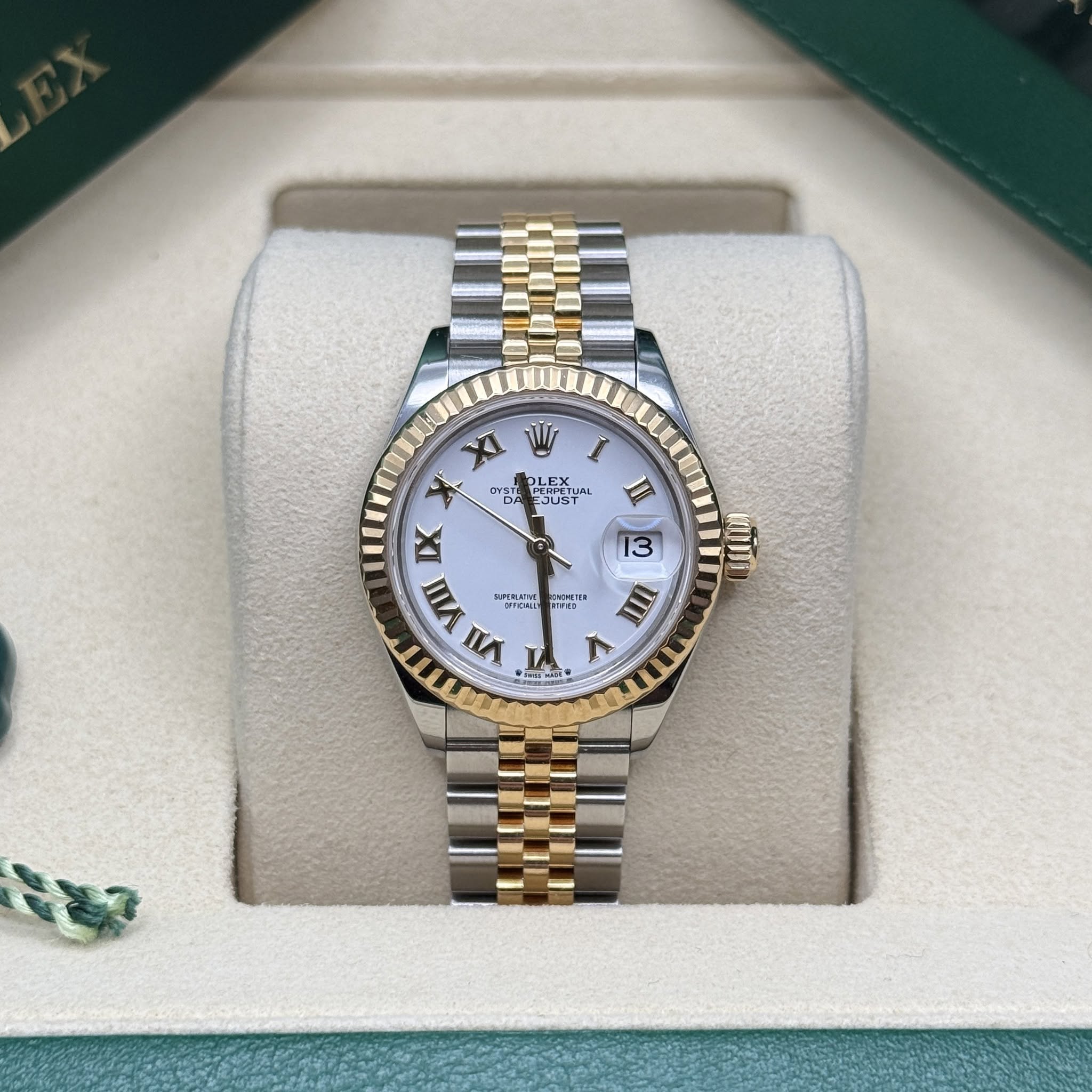 May be an image of wrist watch and text