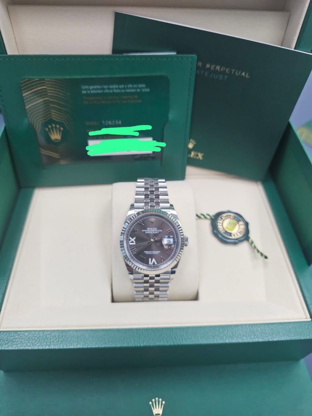 May be an image of wrist watch and text