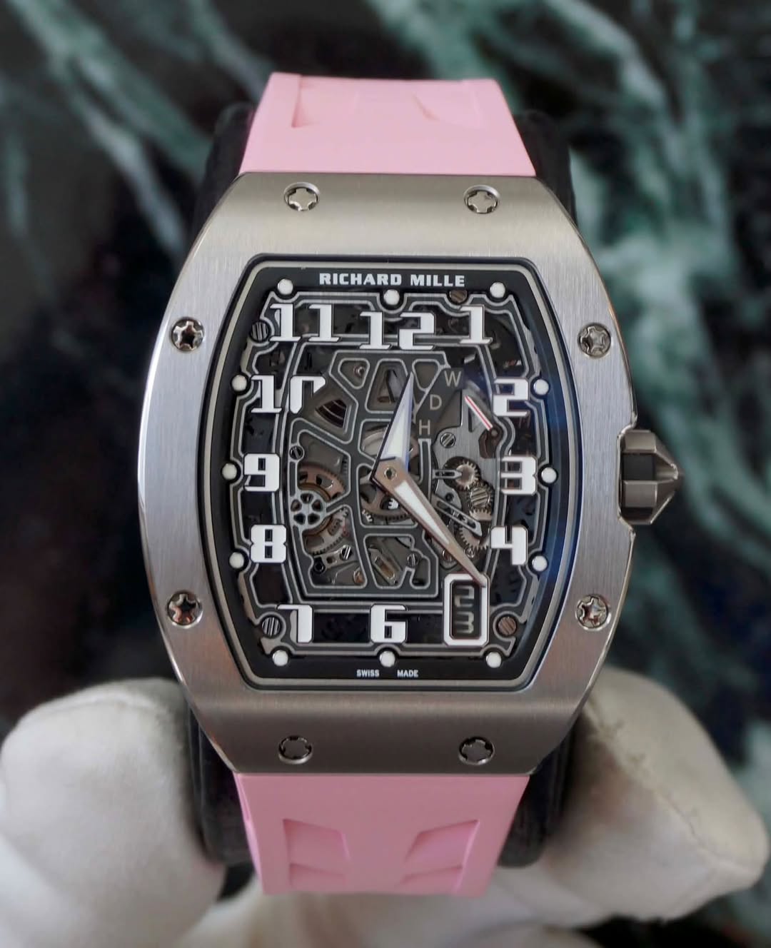 May be an image of wrist watch and text that says 'RICHARD RICHARDMILLE MILLE בדב1 Pr0E 2 ቦ 4 SWISS MADE'