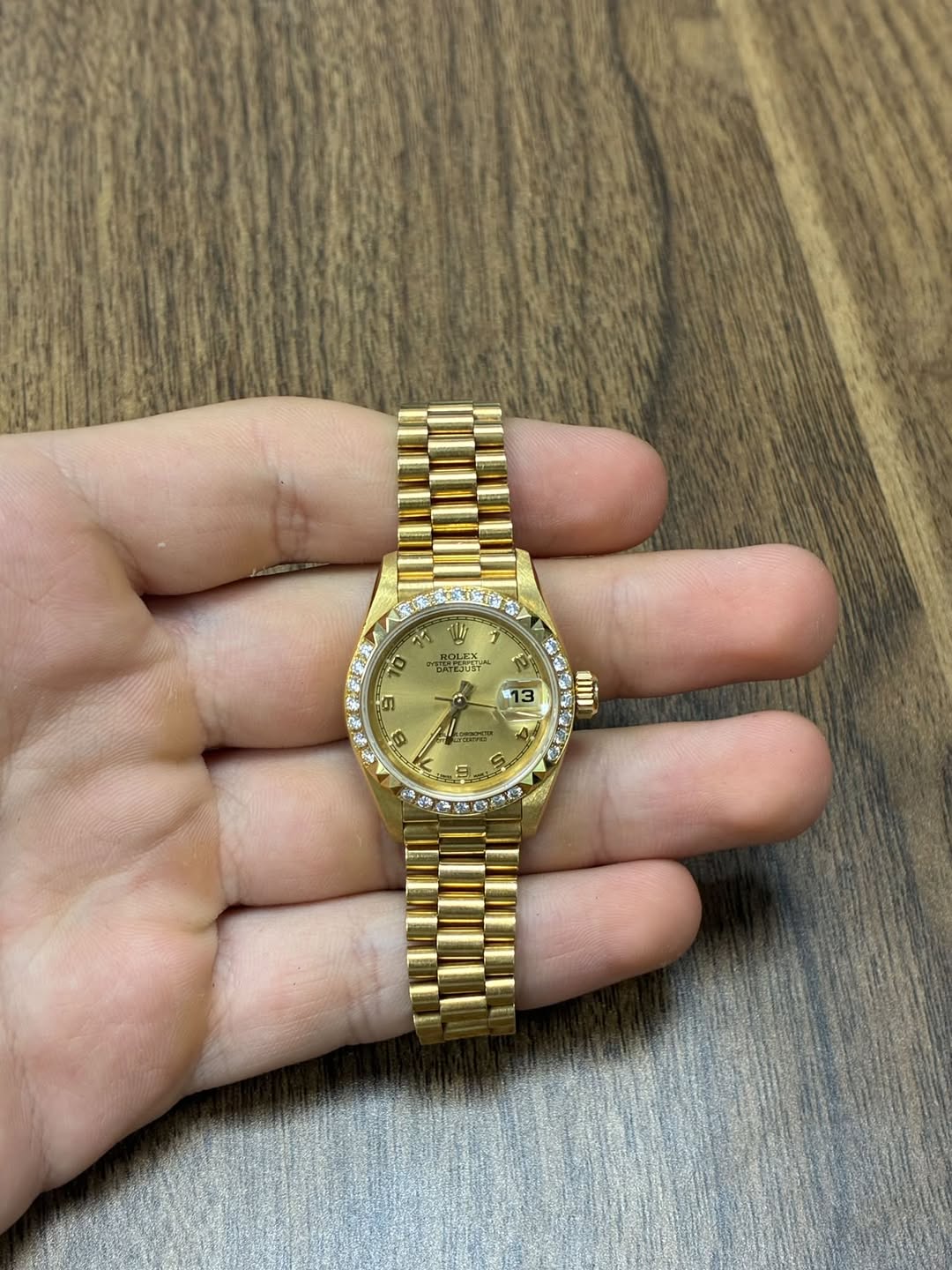 May be an image of wrist watch and text