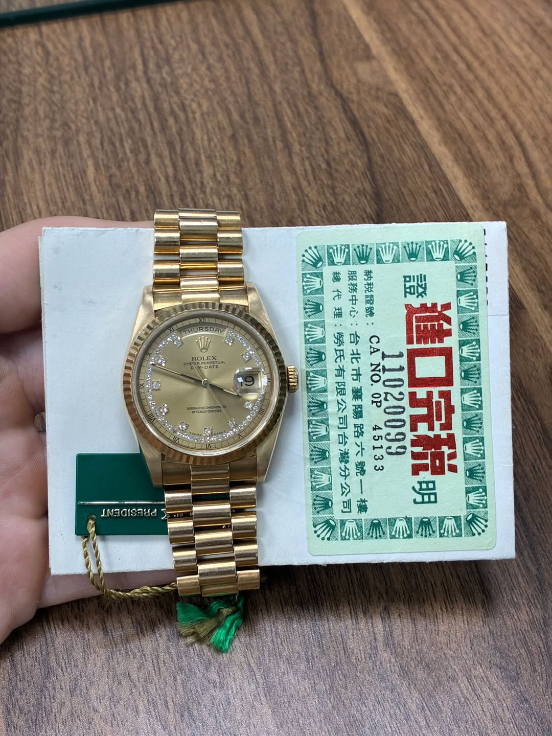 May be an image of wrist watch and text