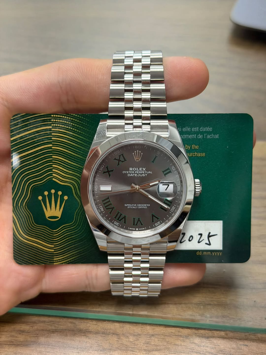 May be an image of wrist watch and text