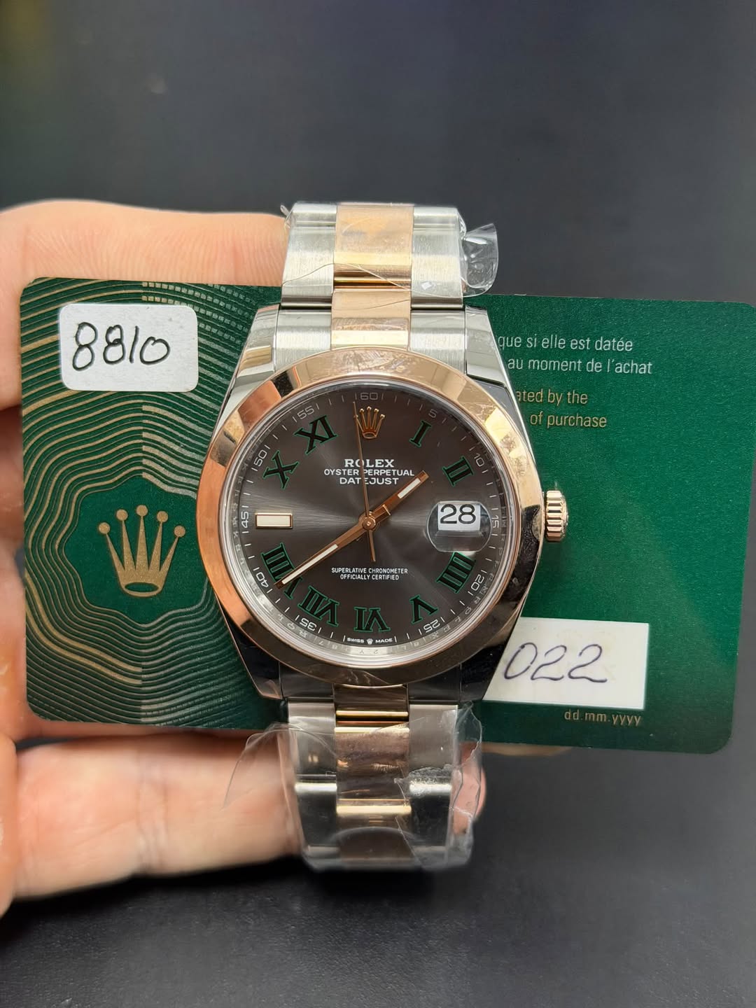 May be an image of wrist watch and text