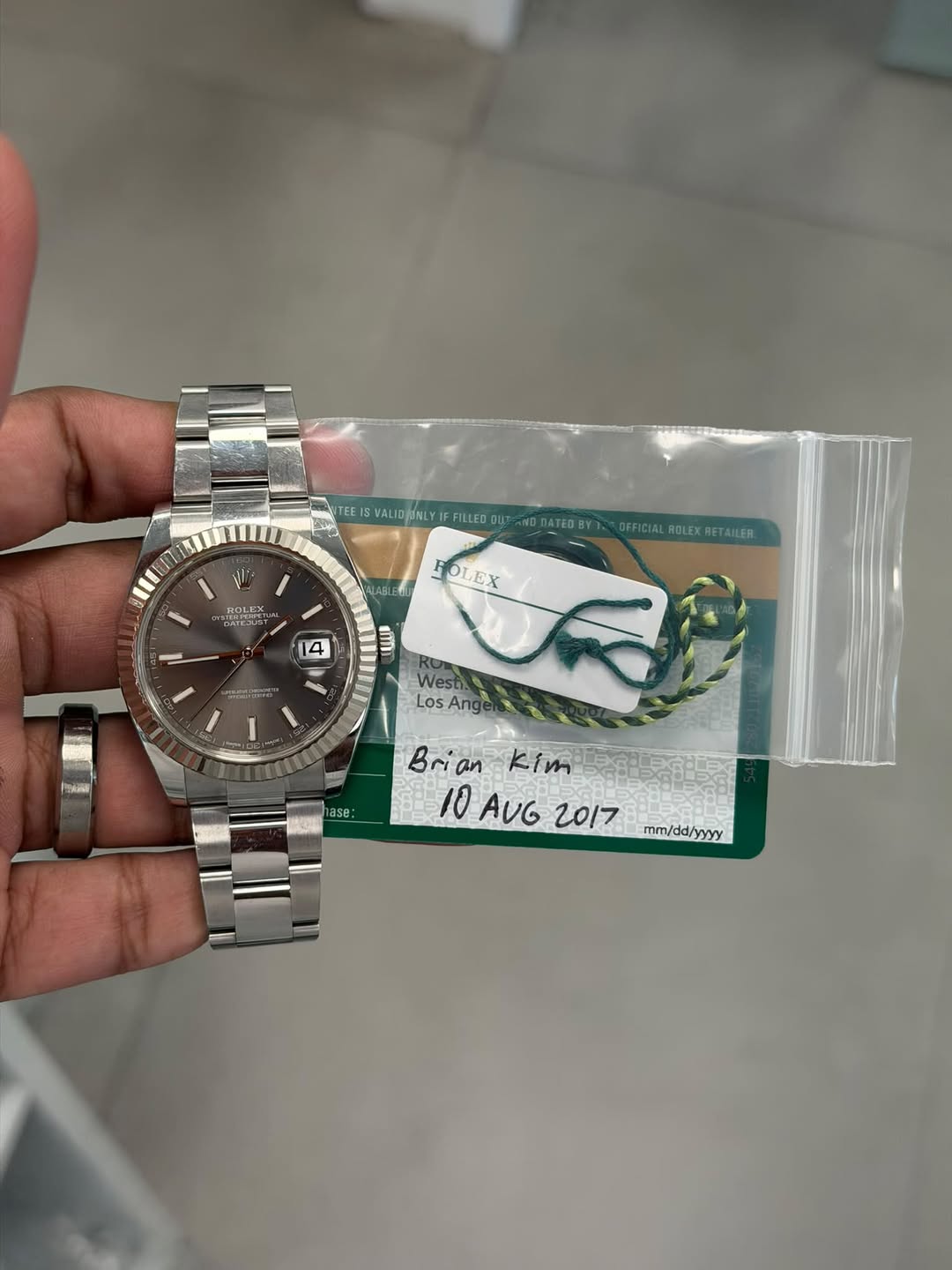 May be an image of wrist watch and text that says 'E TEE VALIG/NLYFFILLED VALID LYIFFILLED UT ATEO K EPETL NTEJUST NTEJUS OFFICIAL ROLEX ALROLEXRETAILER OFFICIALBOLEXRETAMLER…