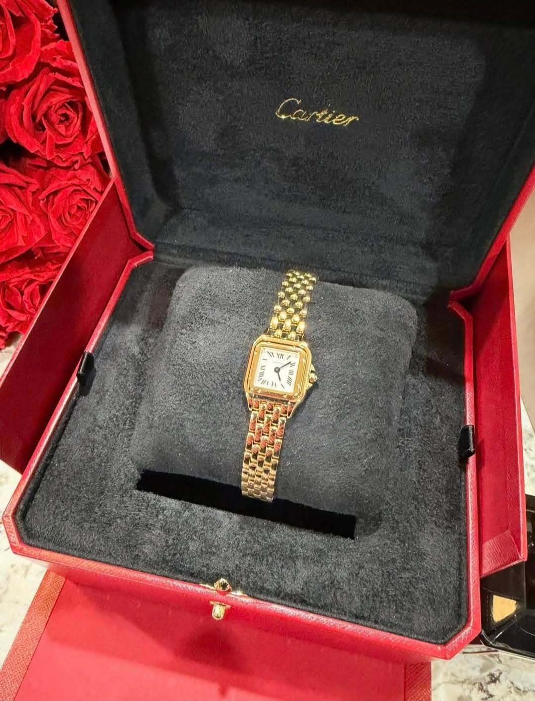 May be an image of wrist watch and text