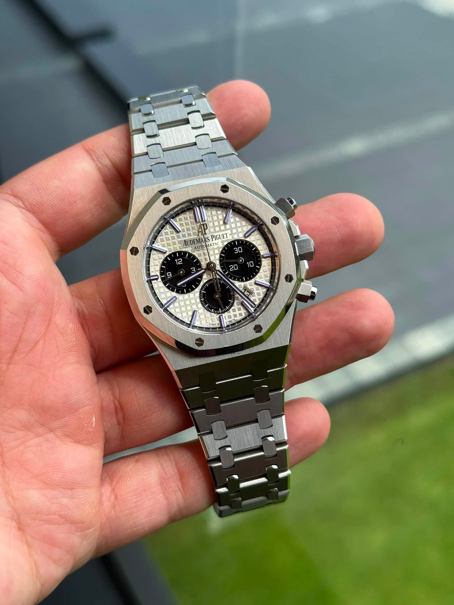 May be an image of wrist watch and text