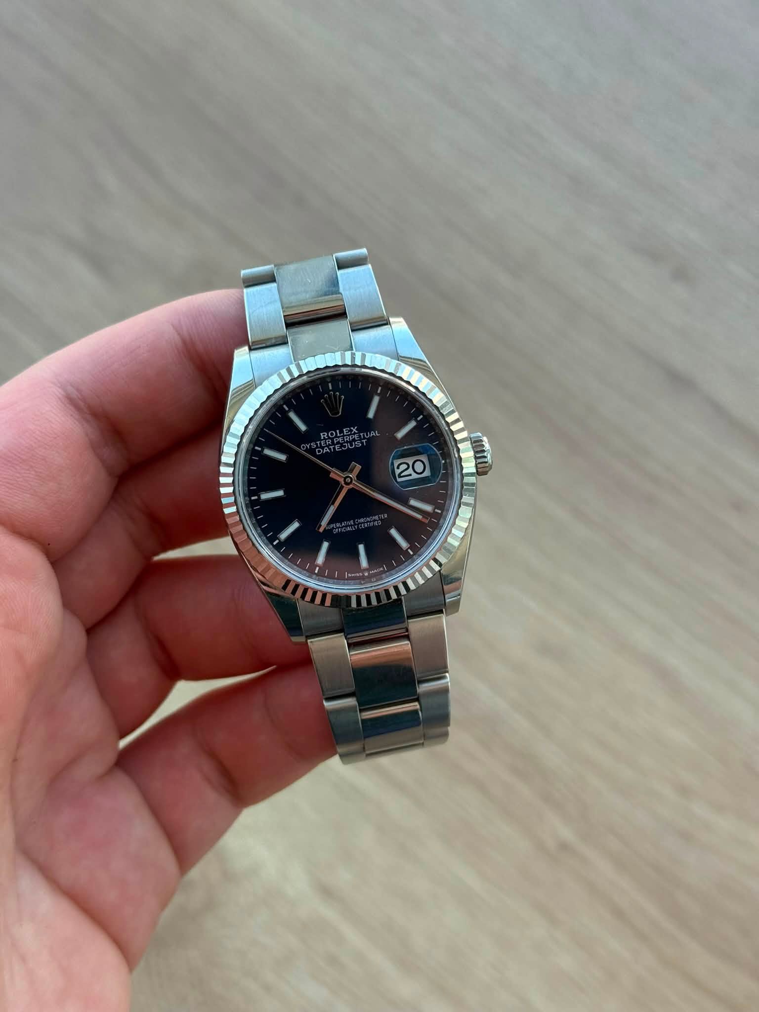 May be an image of wrist watch and text
