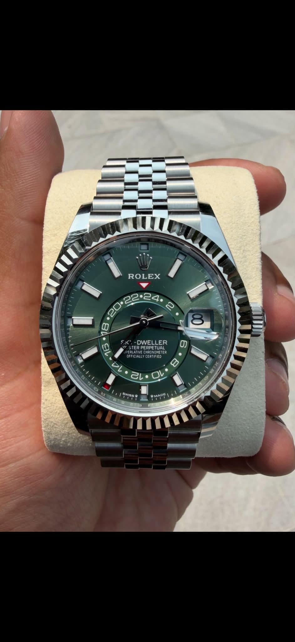 May be an image of wrist watch and text