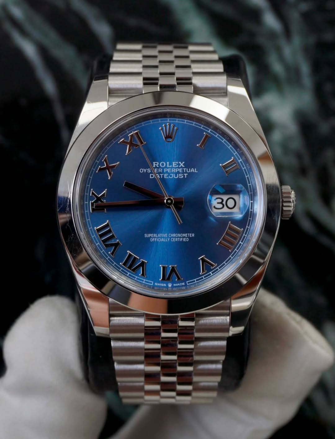 May be an image of wrist watch and text that says 'ROLEX OYS OYSERPERPETUAL E ERPERPETUAL ETUAL DATEJUST ما L 30 SUPERLATIVECHRONOMETE SUERLT CHRONOMETER SUPERLATIVE…