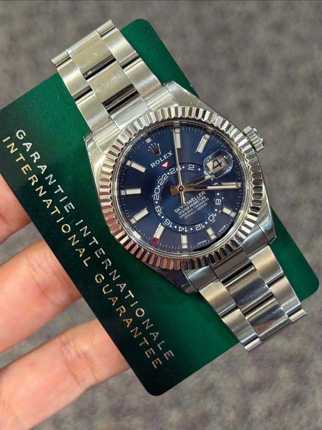 May be an image of wrist watch and text