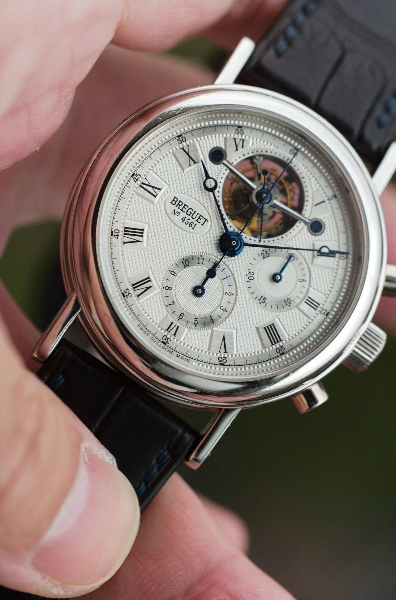 May be an image of wrist watch and text that says 'X 45 A NO BREGUFT VII os 25 יגסי ® 8 5 ၃ံ کی 15 SS LN 8 فغتلهر La g C Sigba SWISS GUILLOCHE T V MAIN 0: III'