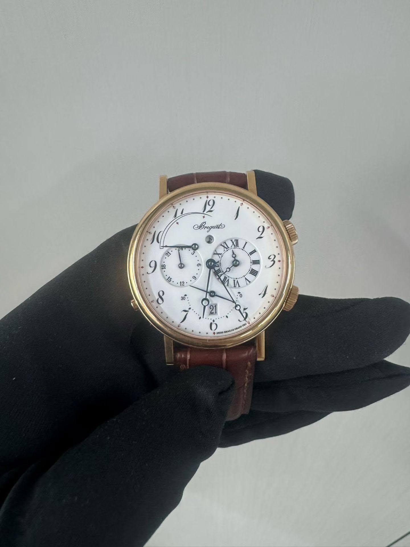 May be an image of wrist watch and text