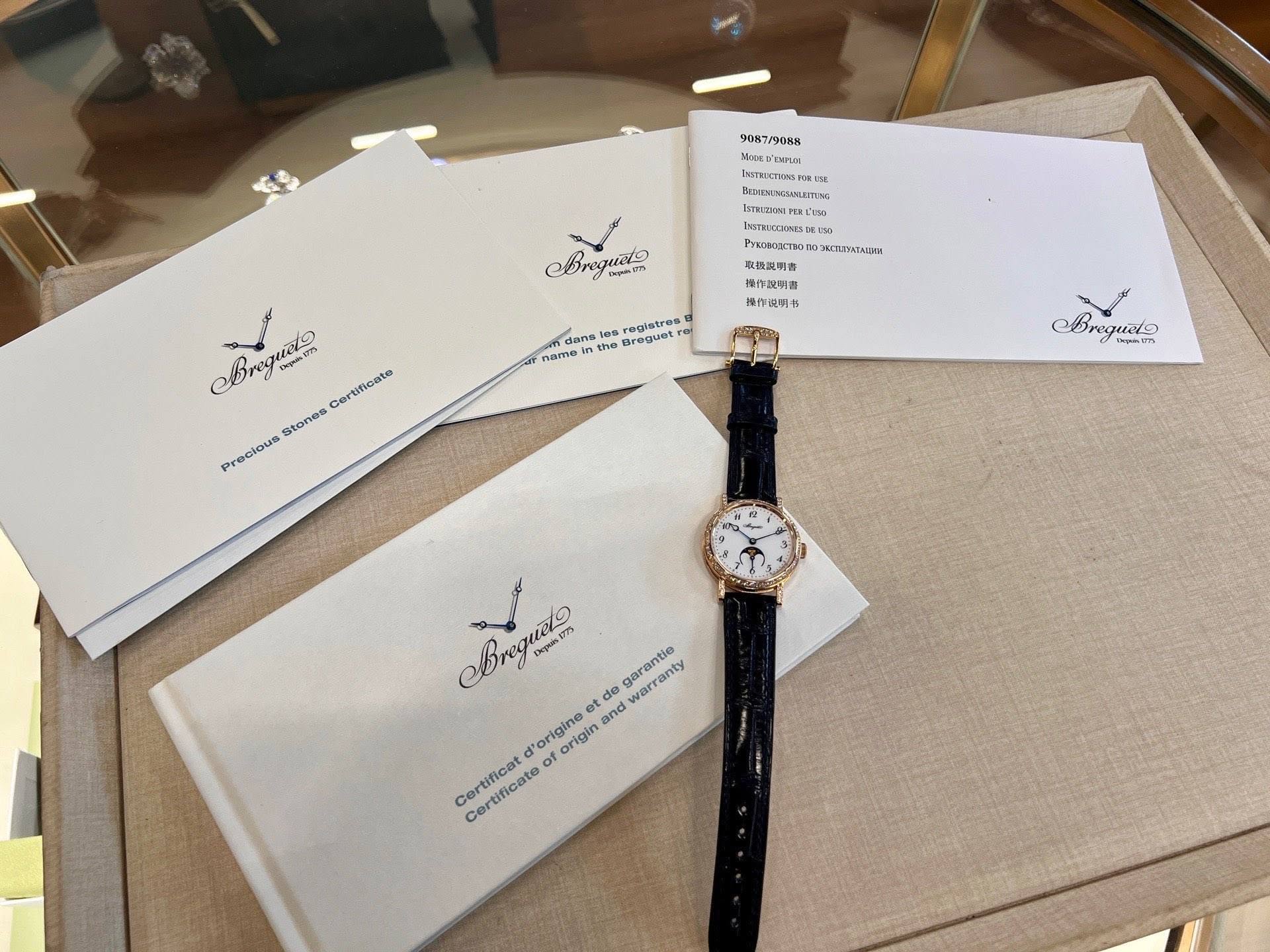 May be an image of jewelry, wrist watch and text