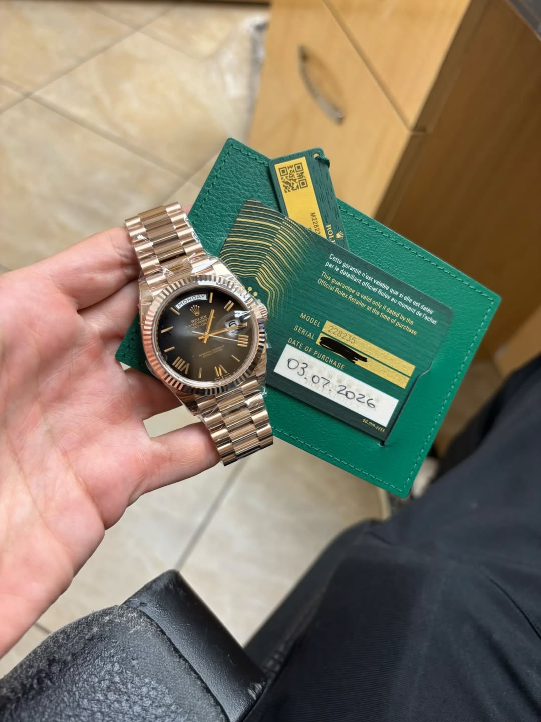 May be an image of wrist watch and text