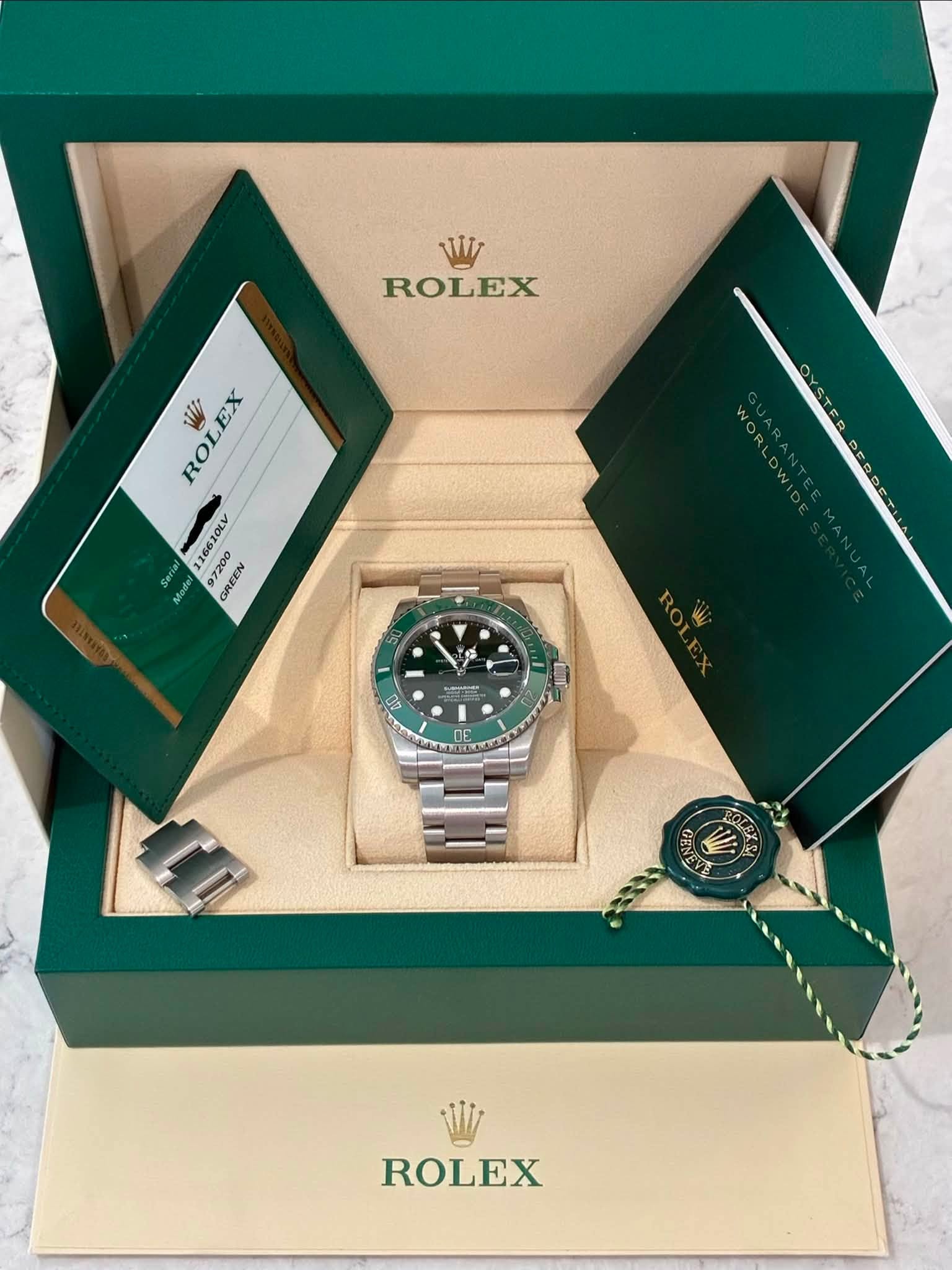 May be an image of wrist watch and text that says 'W ROLEX W ROLEX EX 6610LV 1OLY 7200 RE REty 97200 CREEN NORLDW Y T Ro コ間 00 DE ب GEN ROLEX'